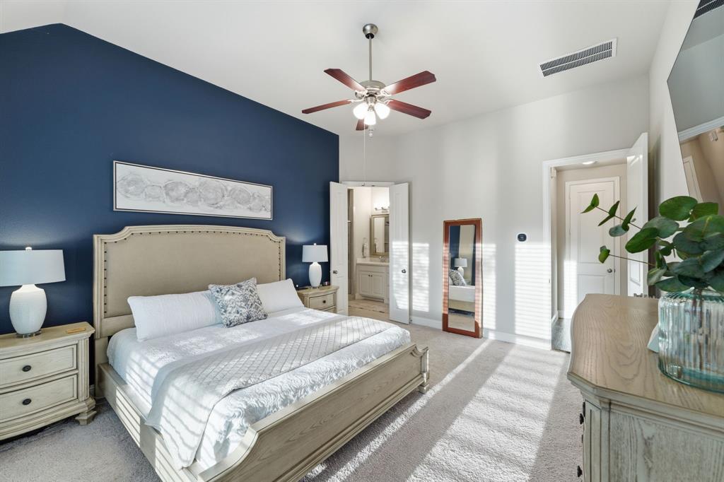 5105 Ember Place Little Elm, TX 76227 - Photo 16 of 35 a bedroom with bed and wooden floor