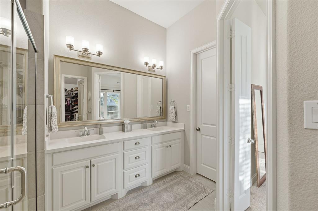 5105 Ember Place Little Elm, TX 76227 - Photo 18 of 35 a bathroom with a double vanity sink mirror and double