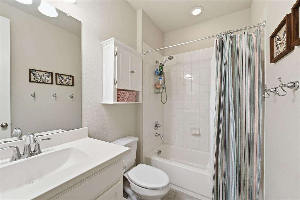 5105 Ember Place Little Elm, TX 76227 - Photo 20 of 35 a bathroom with a sink a toilet and shower