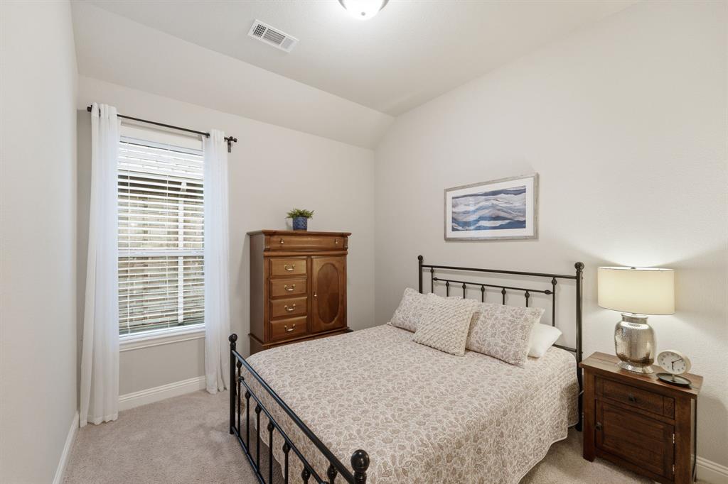 5105 Ember Place Little Elm, TX 76227 - Photo 23 of 35 a bedroom with a bed and a window