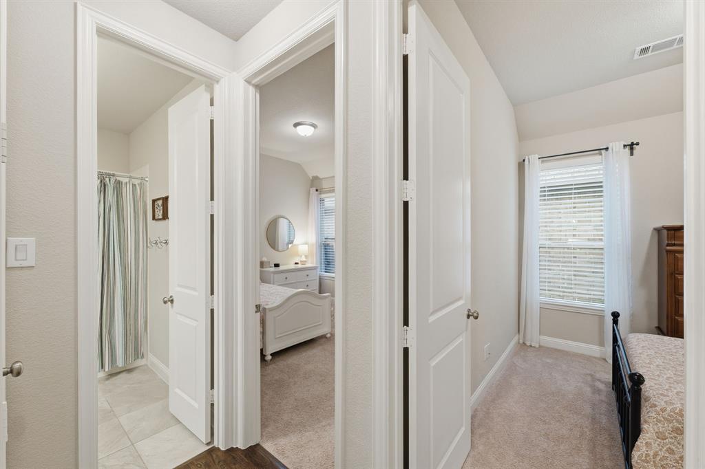 5105 Ember Place Little Elm, TX 76227 - Photo 24 of 35 wooden floor with a bedroom and a mirror