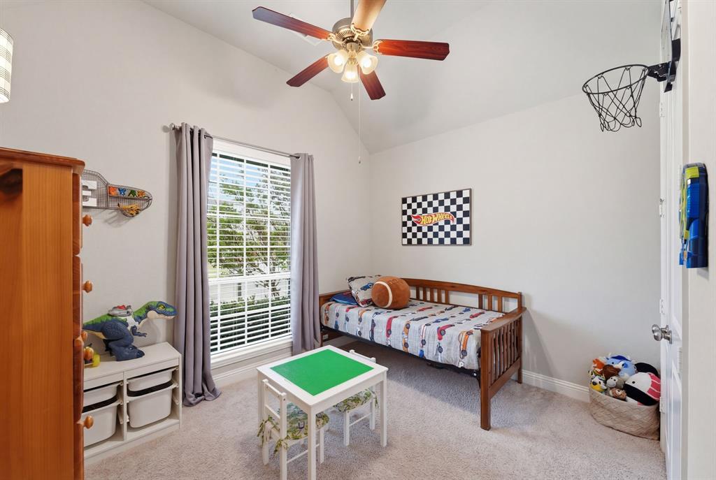 5105 Ember Place Little Elm, TX 76227 - Photo 26 of 35 a bedroom with two beds and a window