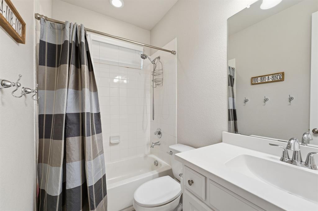 5105 Ember Place Little Elm, TX 76227 - Photo 28 of 35 a bathroom with a sink toilet and shower