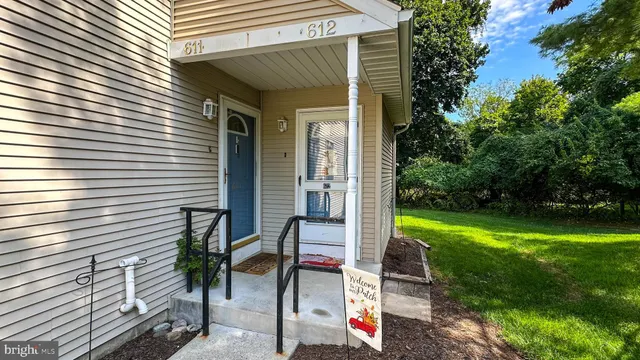 a view of backyard with a patio