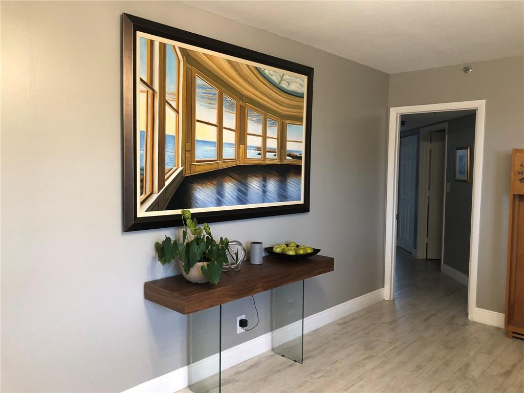 6463 La Costa Drive, Unit 305 Boca Raton, FL 33433 - Photo 12 of 20 a living room with furniture and a potted plant