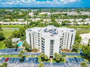 6463 La Costa Drive, Unit 305 Boca Raton, FL 33433 - Photo 17 of 20 a view of a patio with table and chairs and potted plants