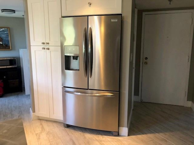6463 La Costa Drive, Unit 305 Boca Raton, FL 33433 - Photo 3 of 20 a view of a refrigerator in kitchen and a refrigerator