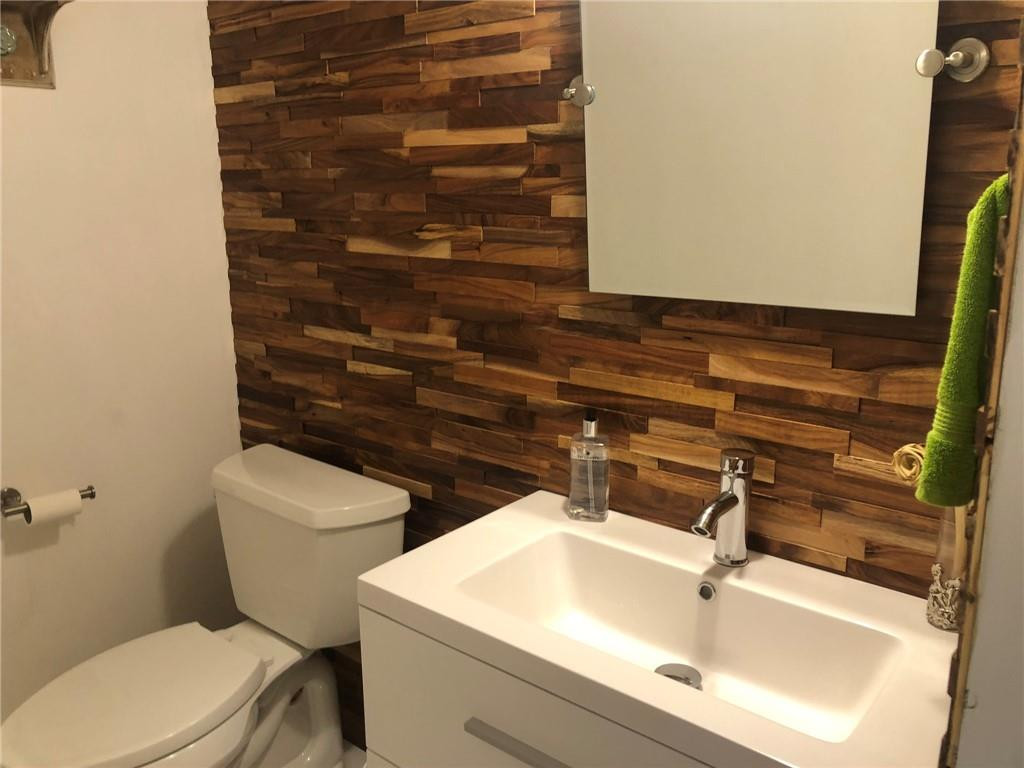 6463 La Costa Drive, Unit 305 Boca Raton, FL 33433 - Photo 5 of 20 a bathroom with a sink and a toilet