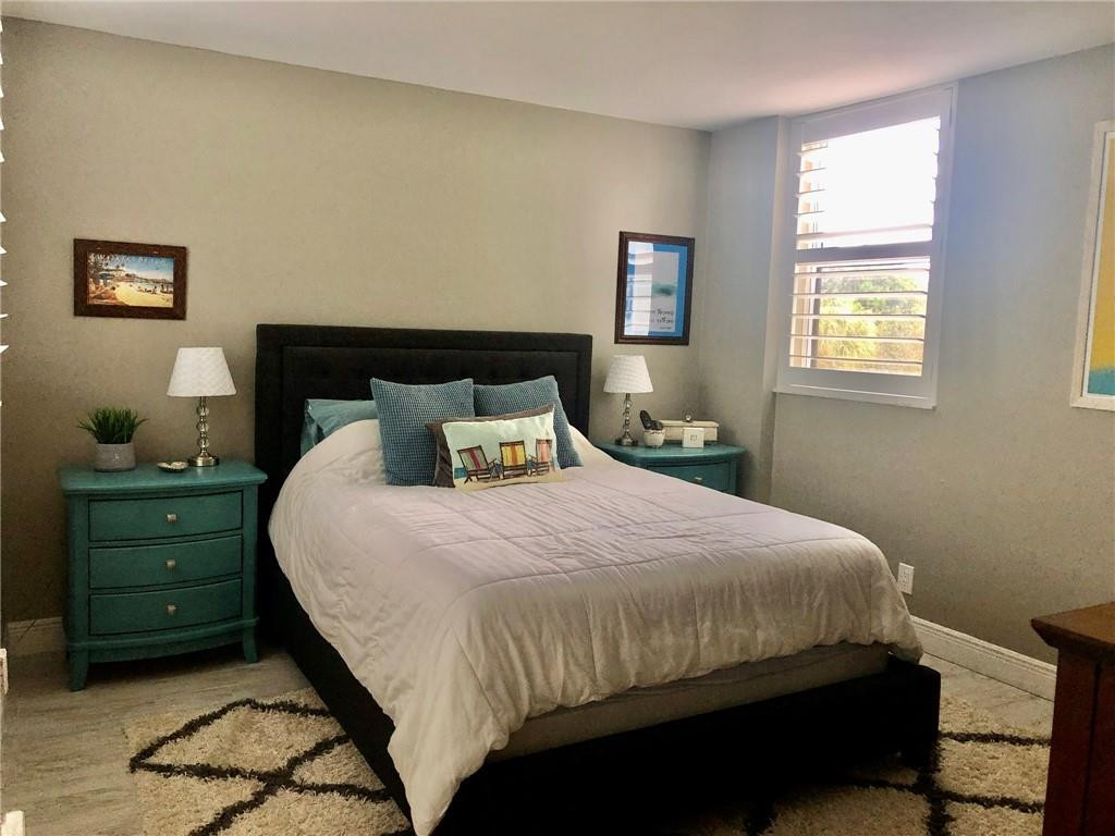 6463 La Costa Drive, Unit 305 Boca Raton, FL 33433 - Photo 7 of 20 a bedroom with a bed and a window