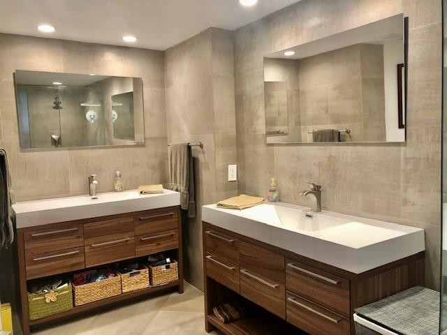 6463 La Costa Drive, Unit 305 Boca Raton, FL 33433 - Photo 8 of 20 a bathroom with a sink and a mirror