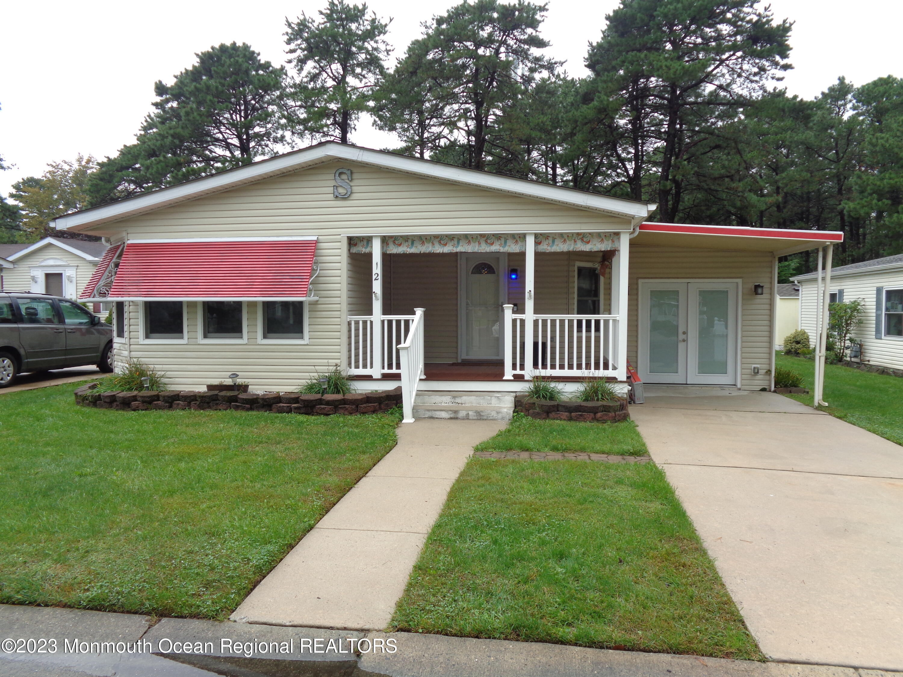 12 Pine Ridge Boulevard Whiting, NJ 08759 - Photo 1 of 23 a front view of a house with a yard
