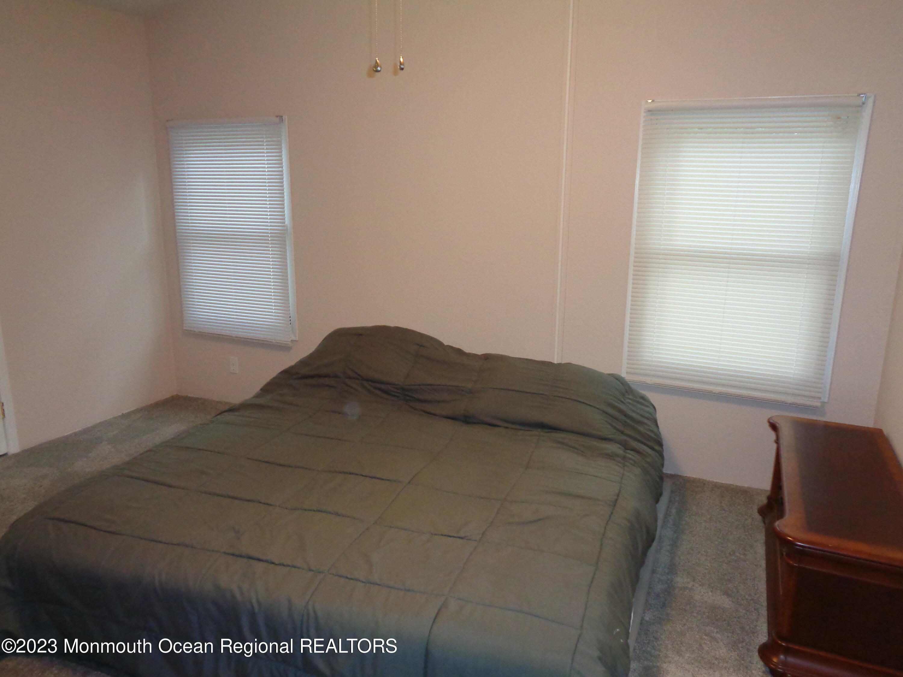 12 Pine Ridge Boulevard Whiting, NJ 08759 - Photo 14 of 23 a bed sitting in a bedroom next to a window