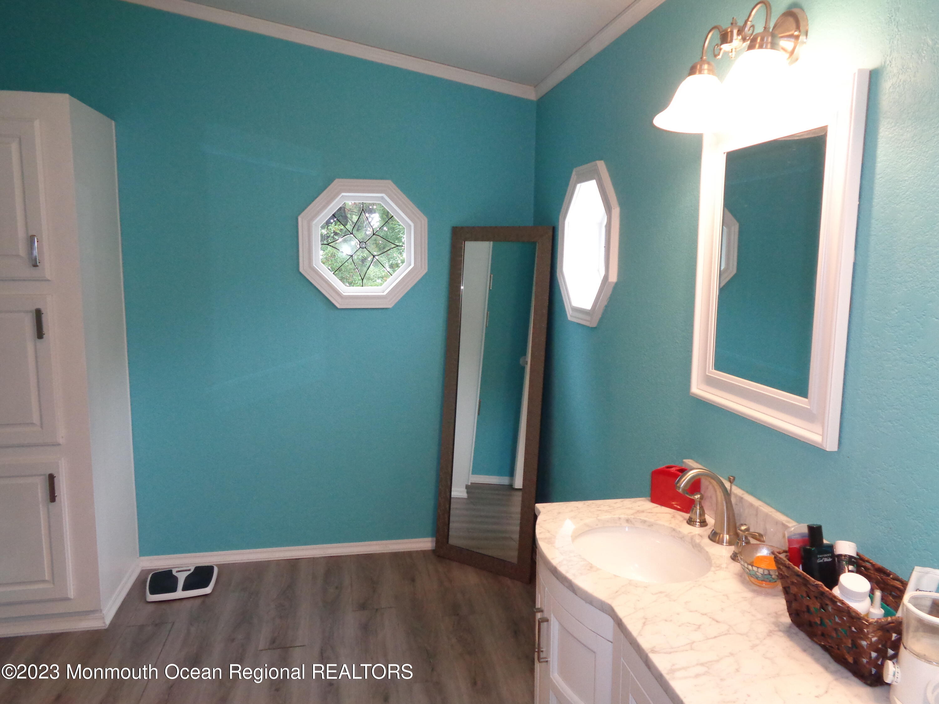 12 Pine Ridge Boulevard Whiting, NJ 08759 - Photo 19 of 23 a view of a hallway with entryway wooden floor and a chandelier