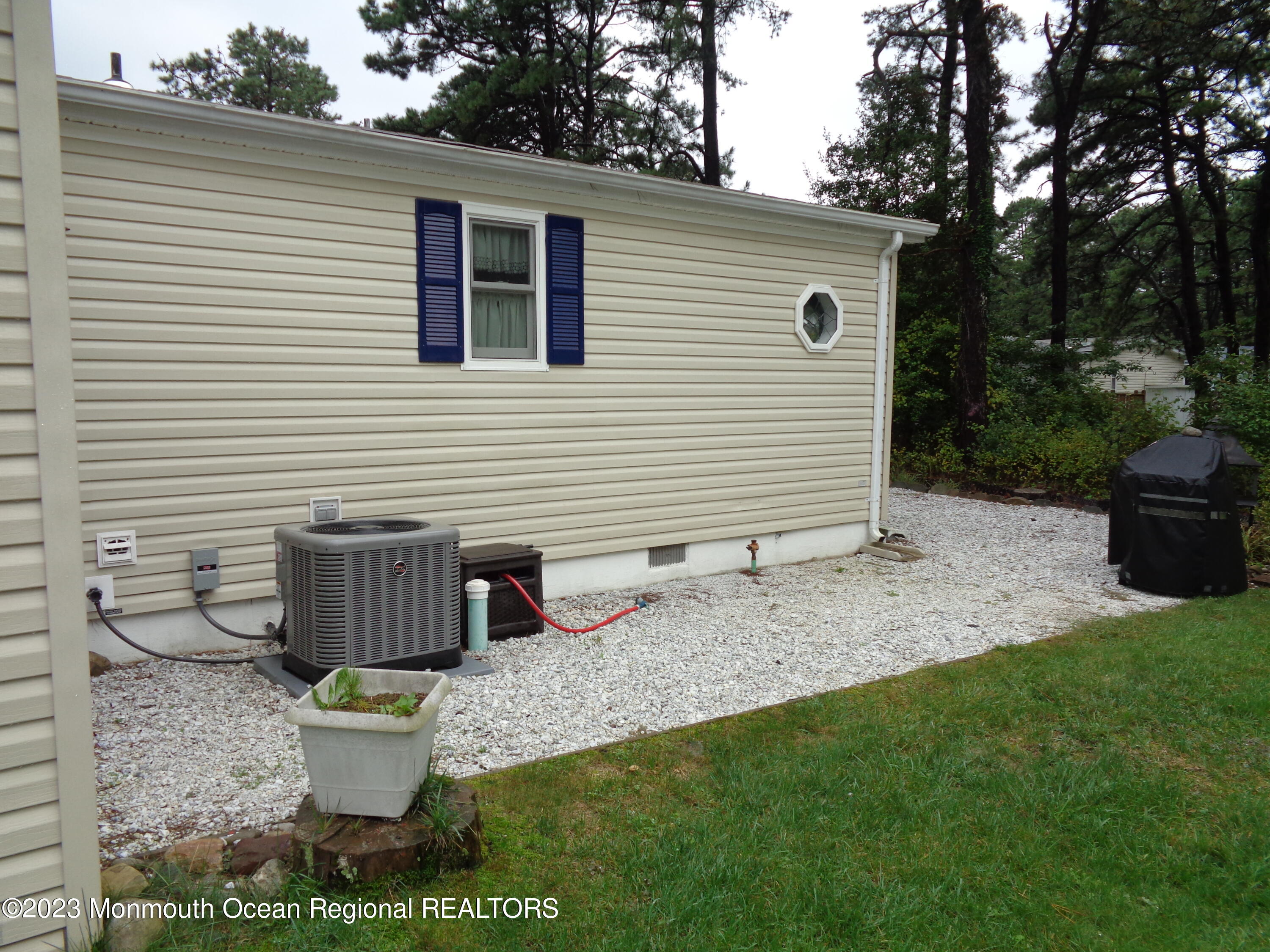 12 Pine Ridge Boulevard Whiting, NJ 08759 - Photo 20 of 23 a view of a backyard with table and chairs