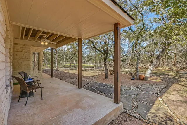 a view of a chairs and table in the patio