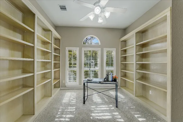 a view of a livingroom with furniture and a window