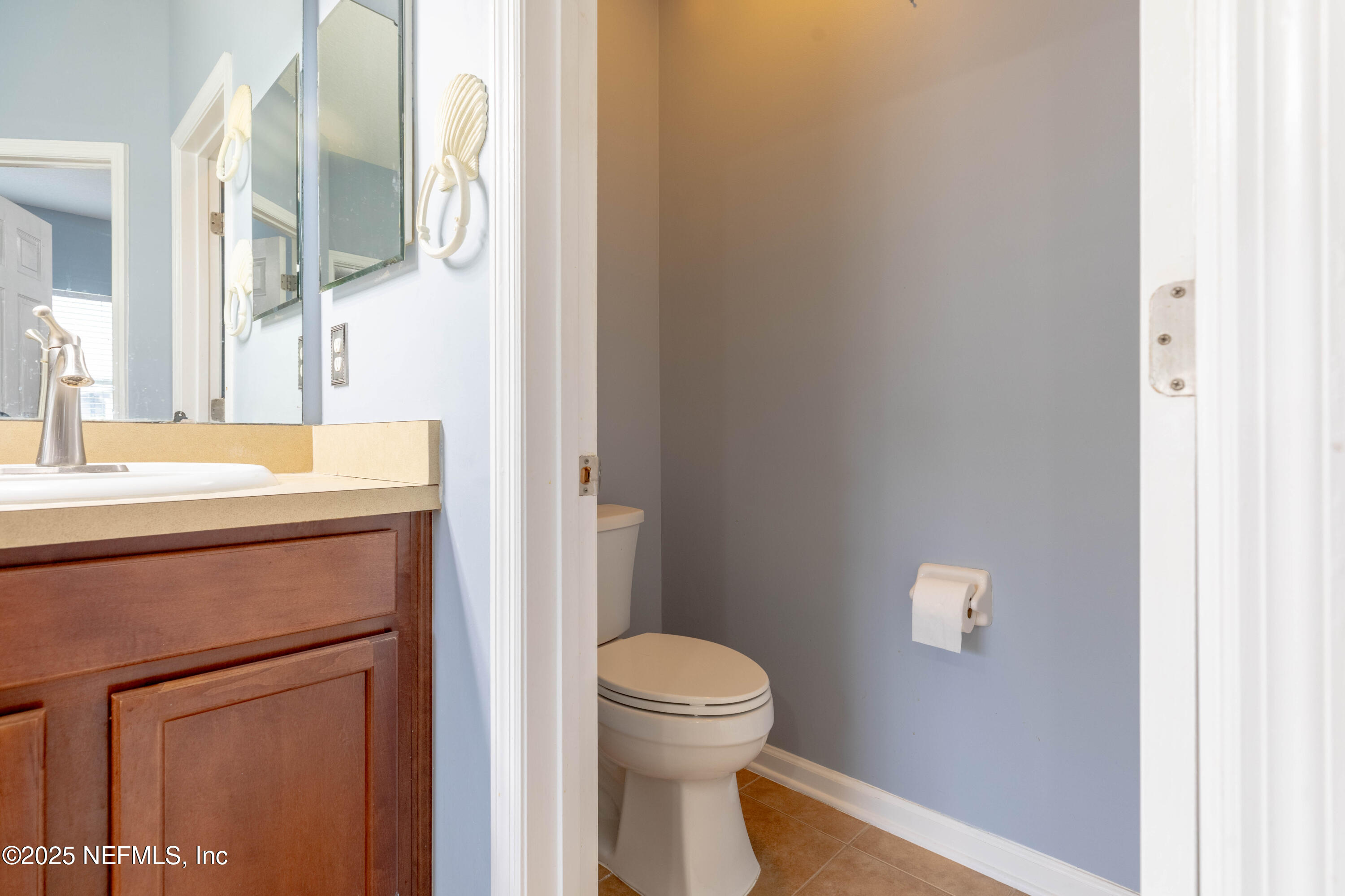 211 Amber Ridge Road Jacksonville, FL 32218 - Photo 15 of 39 a bathroom with a sink and a toilet