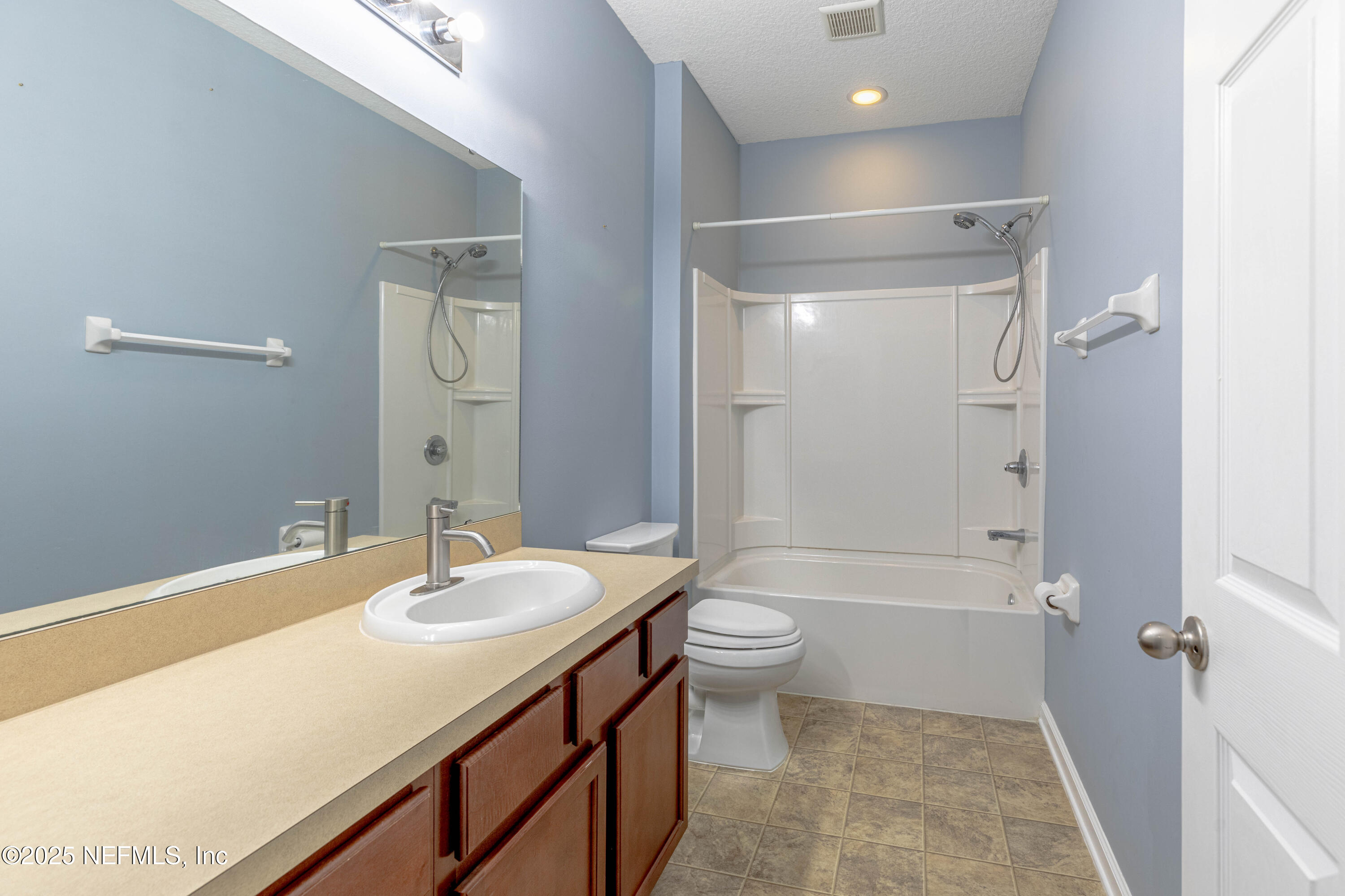 211 Amber Ridge Road Jacksonville, FL 32218 - Photo 17 of 39 a bathroom with a sink a toilet and shower