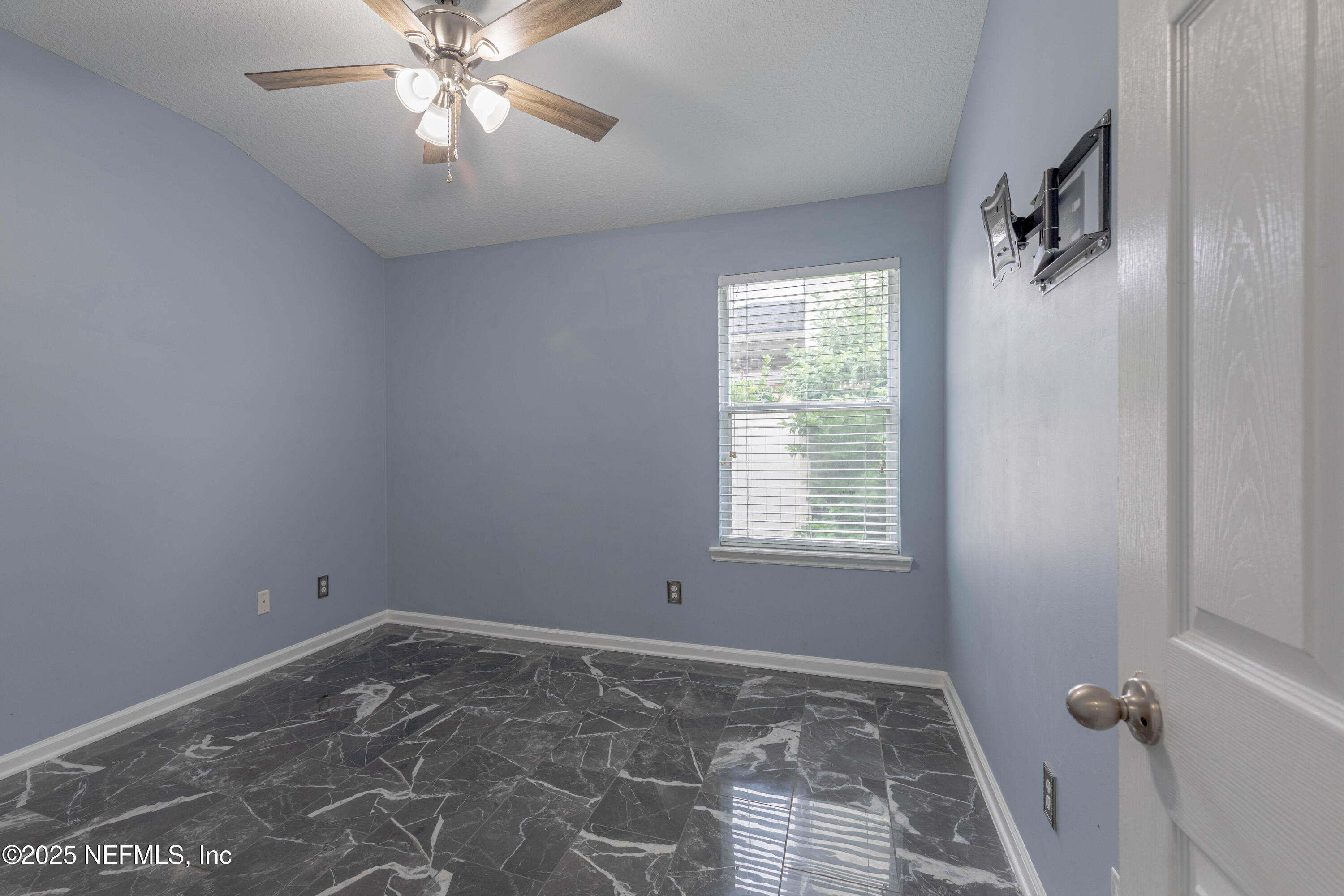 211 Amber Ridge Road Jacksonville, FL 32218 - Photo 18 of 39 a view of an empty room with a window