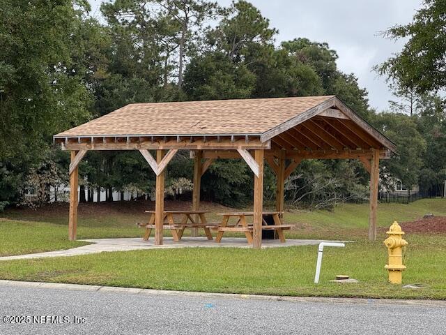 211 Amber Ridge Road Jacksonville, FL 32218 - Photo 30 of 39 a view of a swimming pool with a patio and a yard