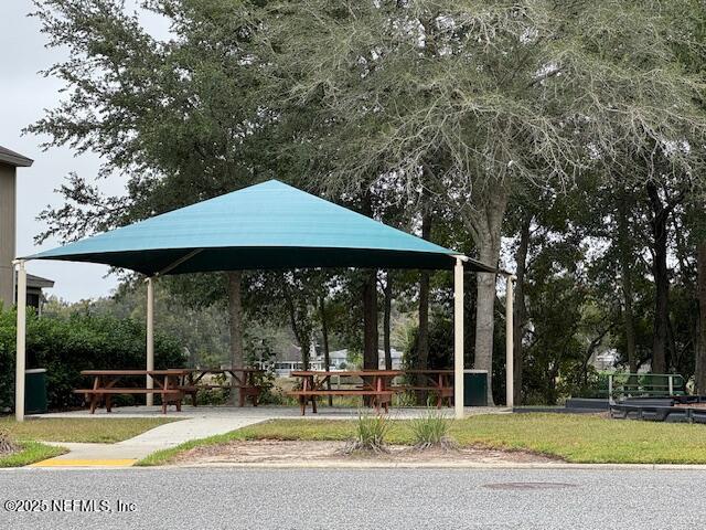 211 Amber Ridge Road Jacksonville, FL 32218 - Photo 32 of 39 a view of a swimming pool with sitting area