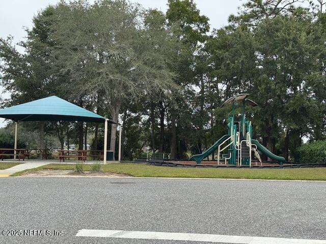 211 Amber Ridge Road Jacksonville, FL 32218 - Photo 33 of 39 a view of a house with a yard and sitting area
