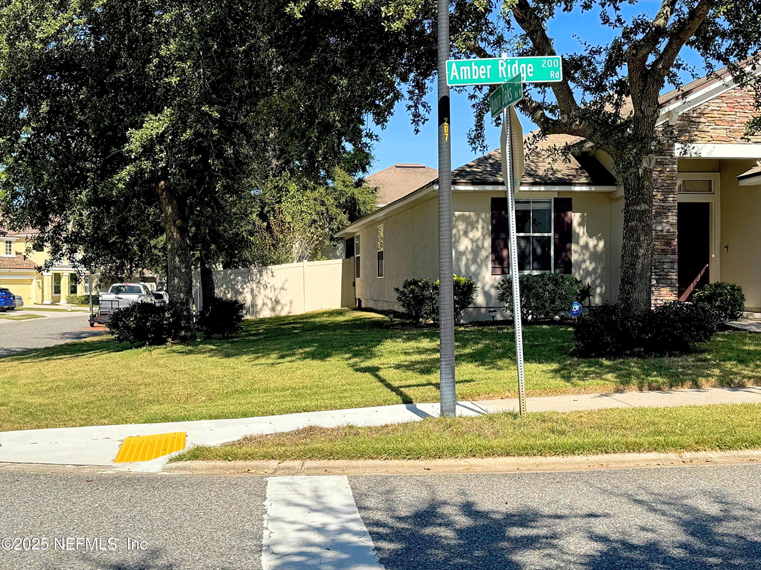 211 Amber Ridge Road Jacksonville, FL 32218 - Photo 38 of 39 a view of a house with backyard and tree