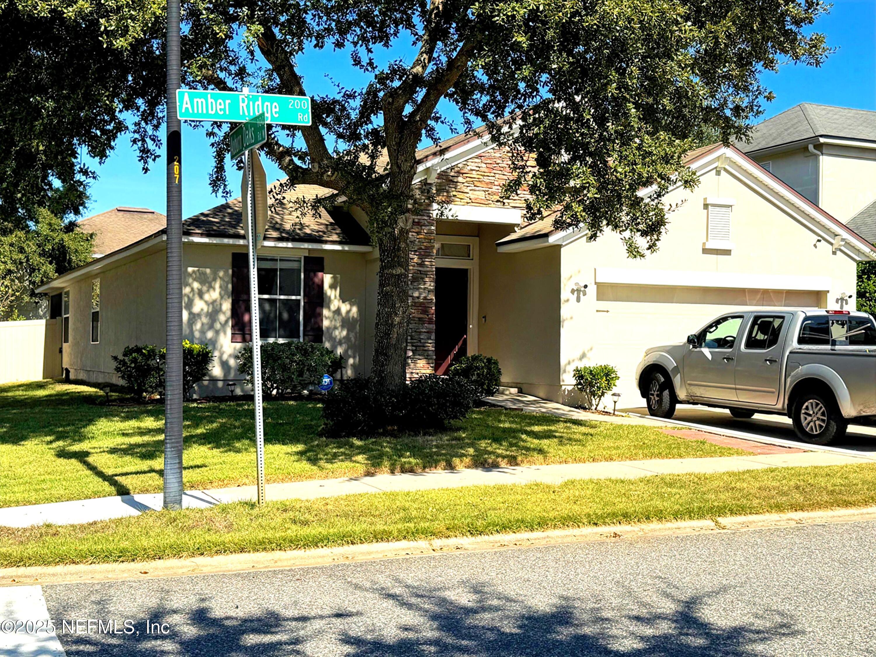 211 Amber Ridge Road Jacksonville, FL 32218 - Photo 39 of 39 a view of a house with a yard