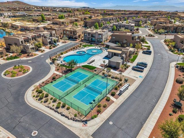 5010 Escapes Drive St. George, UT 84770 - Photo 35 of 46 Aerial perspective of suburban area with a pool area and mountains