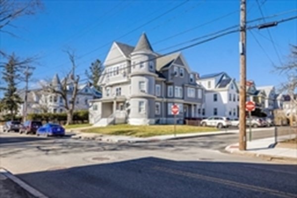 175 Hancock Street Everett, MA 02149 - Photo 1 of 15 a view of a building with mountains in the background