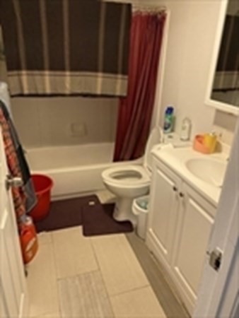 175 Hancock Street Everett, MA 02149 - Photo 11 of 15 a bathroom with a sink a toilet and bathtub