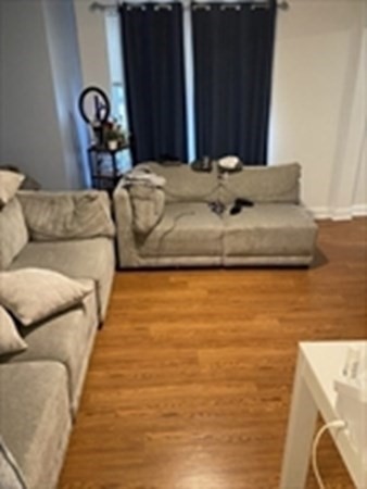 175 Hancock Street Everett, MA 02149 - Photo 12 of 15 a bed sitting in a bedroom next to a window