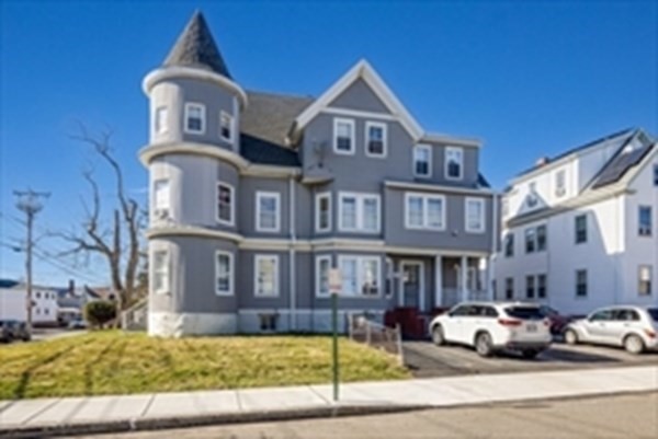 175 Hancock Street Everett, MA 02149 - Photo 2 of 15 a view of a car parked in front of a brick house