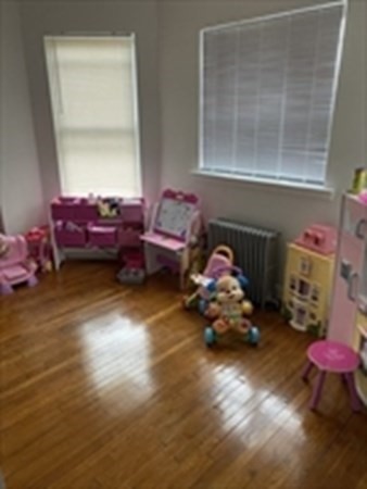 175 Hancock Street Everett, MA 02149 - Photo 5 of 15 a bedroom with furniture and a window