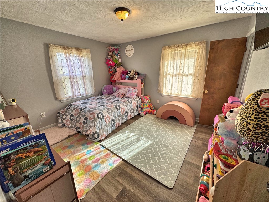 2047 Cline Road Rural Retreat, VA 24368 - Photo 13 of 35 a bedroom with two beds next to a window