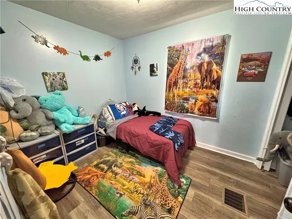 a bed room with a bed and a couch