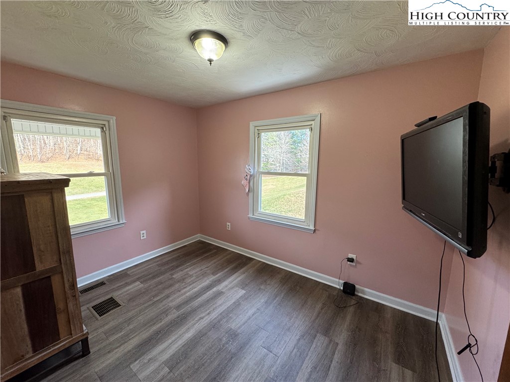 2047 Cline Road Rural Retreat, VA 24368 - Photo 17 of 35 a view of room with window and wooden floor