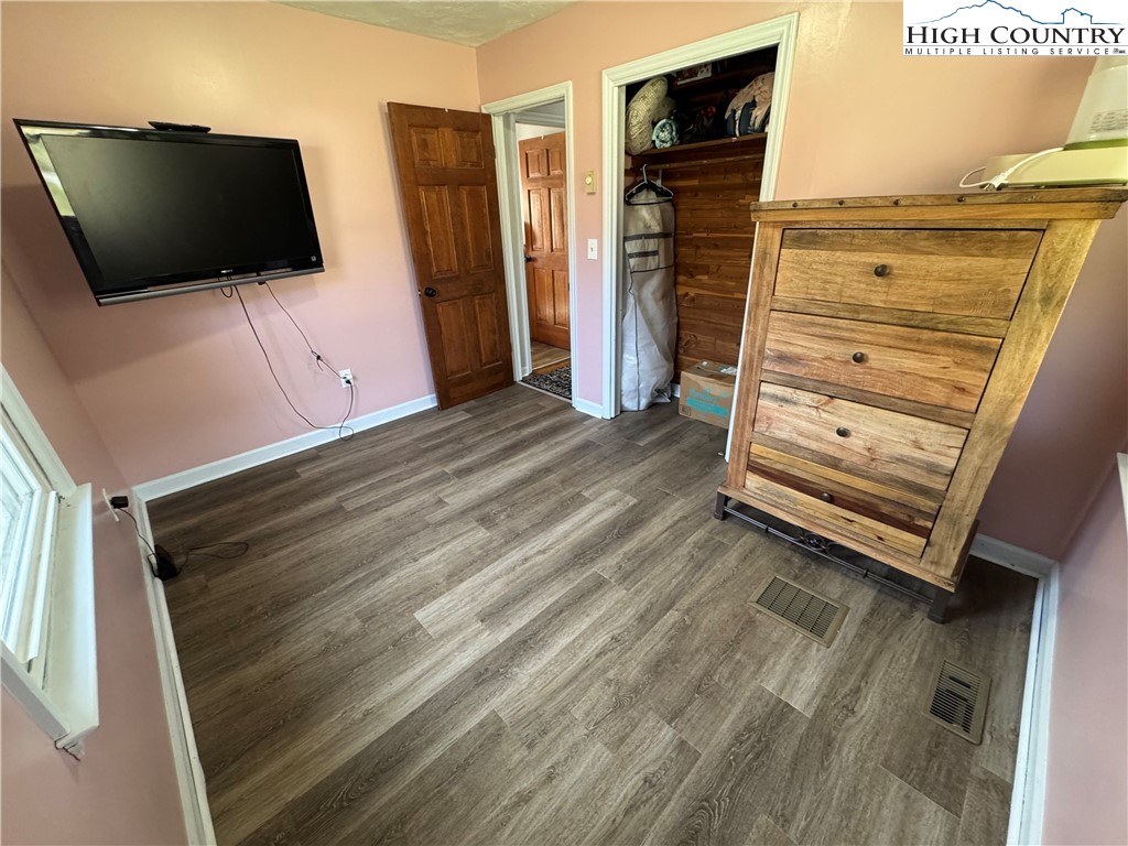 2047 Cline Road Rural Retreat, VA 24368 - Photo 18 of 35 a view of a bedroom with furniture and flat screen tv