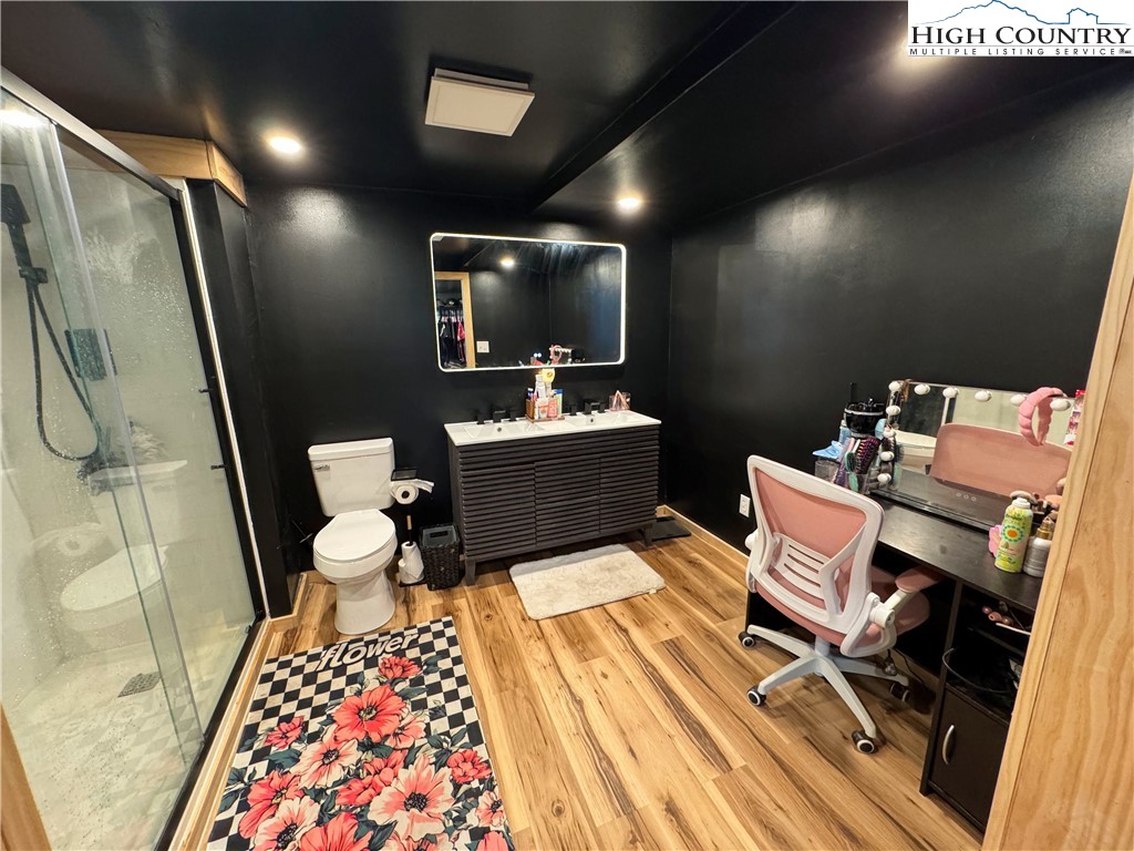 2047 Cline Road Rural Retreat, VA 24368 - Photo 25 of 35 a bathroom with a sink mirror vanity and toilet