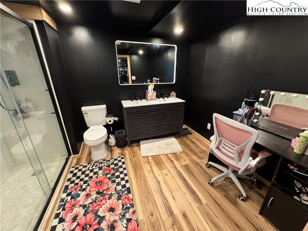 2047 Cline Road Rural Retreat, VA 24368 - Photo 27 of 35 a bathroom with a sink mirror vanity and toilet