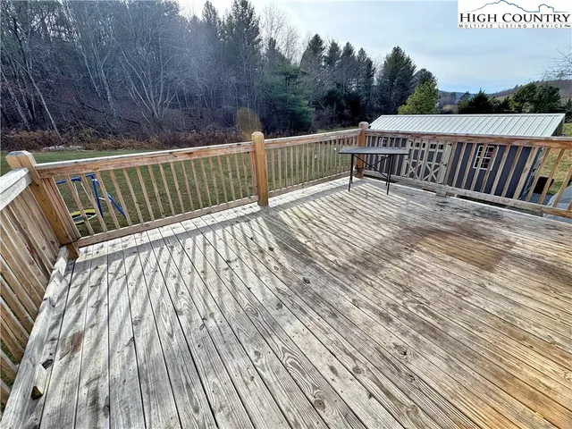 a view of deck with wooden floor and outdoor seating