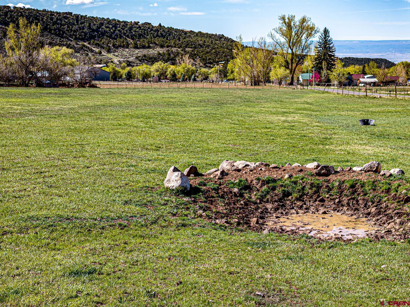 Lot 2 Surface Creek Road Cedaredge, CO 81413 - Photo 5 of 15 a view of a lake with an outdoor space