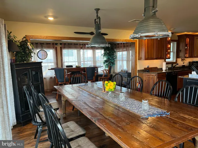 a view of a dining room with furniture and window