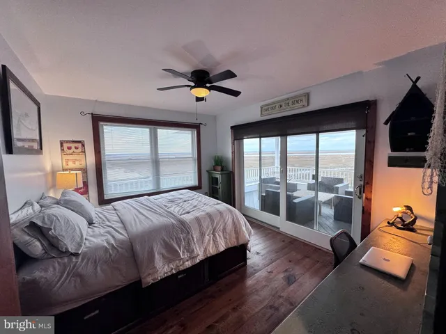 a roof deck with a table and chairs
