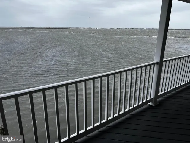 a bathroom with a sink a toilet a mirror and shower