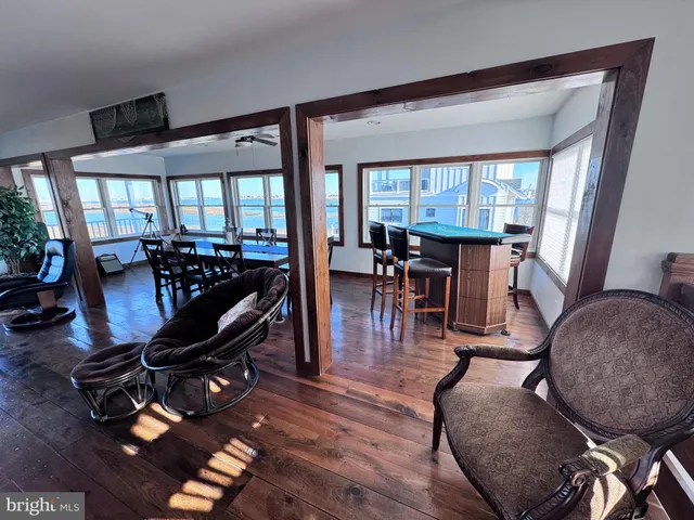a bathroom with a granite countertop toilet a sink and a mirror