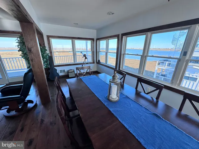 a spacious bedroom with a large bed and a dresser