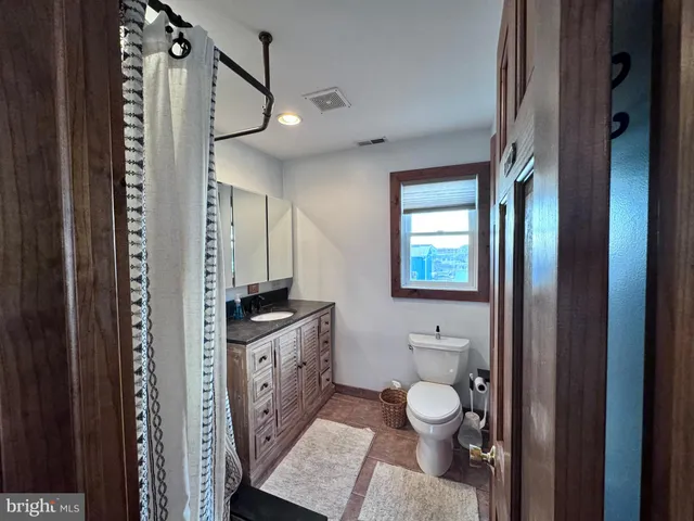 a terrace of a house with outdoor seating