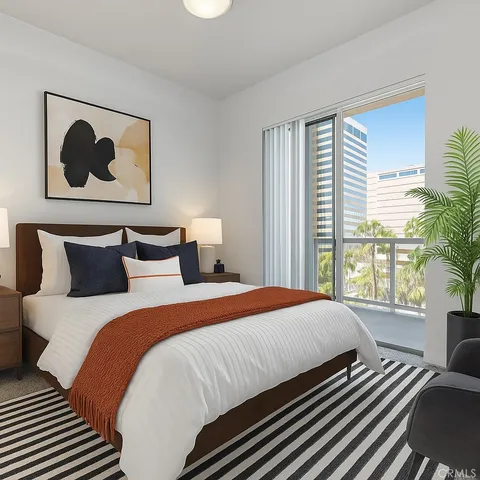 a bedroom with bed painting and a large window