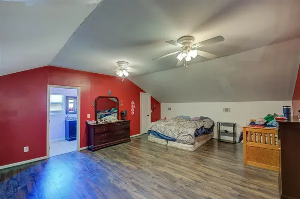 a view of a livingroom with furniture and chandelier fan